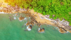 Aerial Top views over beaches, ocean waves crashing on rocks and sand. beautiful tropical sea. Khanom Sichon beaches. Nakhon Si Thammarat, Thailand. 4K drones
