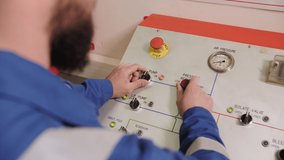 specialist stands at the control panel, apparat for checking oil drill pipes - Powered by Shutterstock - Get 15% off with code: PIKWIZARD15