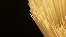 Background Of Spaghetti Pasta. Uncooked Italian Pasta Golden Rotating Backdrop. Healthy Eating Concept. Raw Dried Organic Pasta. Long Macaroni, Rotating Background. Italian Culture - Powered by Shutterstock - Get 15% off with code: PIKWIZARD15