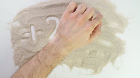 plus 25 degrees Top view draw on the sand. Caucasian hands write text in beige sand. Vacation and travel. Beach on vacation. Sand painting. Creativity from natural materials.