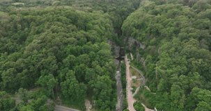 Aerial drone video of streets and buildings of Watkins Glen Village NY USA in summer season, green trees, gorge, Seneca Lake.
