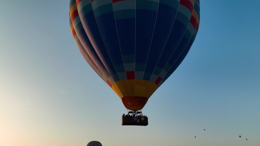 4K Aerial view of Goreme. Colorful hot air balloons fly over the valleys.The famous city of Cappadocia, Turkey.