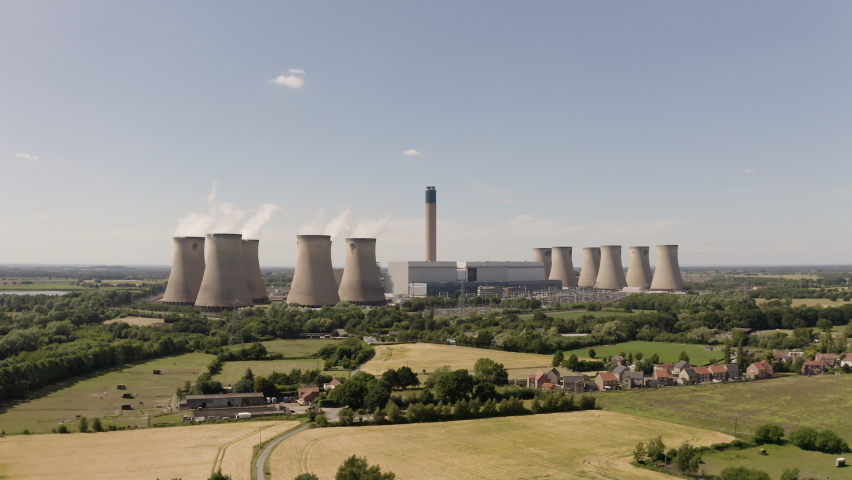 4K aerial drone footage of a large coal fired power station with cooling towers, chimney and boiler house in an air pollution or carbon footprint concept | Shutterstock HD Video #1091737807