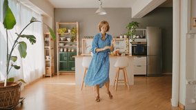 Cinematic storytelling footage of a beautiful senior woman spending time in her cozy apartment, doing daily lifestyle activities. Dancing and having fun - Powered by Shutterstock - Get 15% off with code: PIKWIZARD15