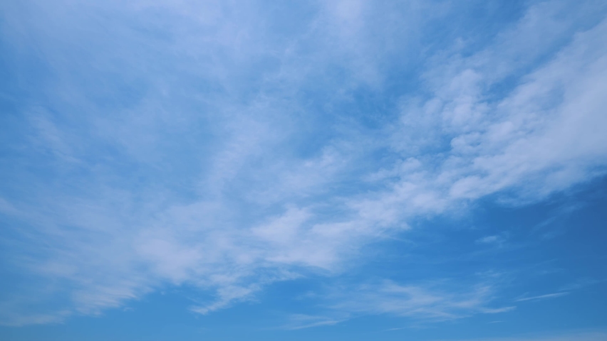 Time-lapse of blue sky and white clouds 4K UHD Royalty-Free Stock Footage #1091742097