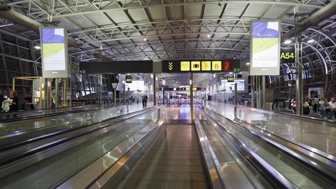 Zaventem, Brussels, Belgium 22 April 2022:  Flat escalator and gate signage at Zaventem Brussels International airport