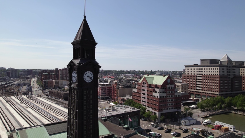 Aerial view around the Lackwana clock tower at the Hoboken NJ Transit Terminal, in New Jersey, USA - orbit, drone shot