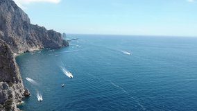 Aerial Drone Video around Capri, Italy showing the Cliffs, Boats, and Mediterranean Sea