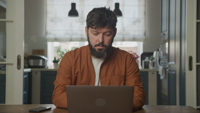 Man working stressed on a computer laptop 