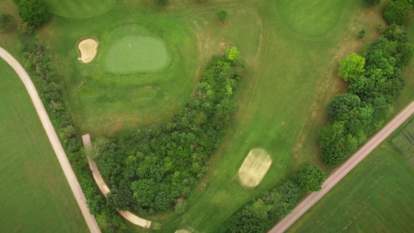 Top aerial view of green golf course with grass. Green gold field | Shutterstock HD Video #1091758385