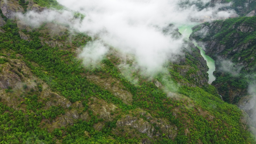 Beautiful Summer mountain forest with river top down aerial view, Fly over sky and clouds, Pure green nature | Shutterstock HD Video #1091759427