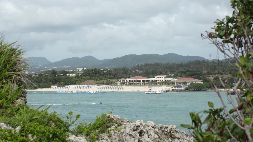 ONNA-SON, OKINAWA, JAPAN - AUGUST 2021 : View of Manza beach (Ocean or sea) in daytime. Summer holiday, vacation and resort concept video. | Shutterstock HD Video #1091760895