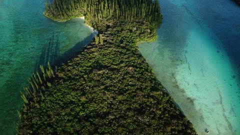 The small Ile Mwareya is part of the Isle of Pines in New Caledonia - aerial flyover