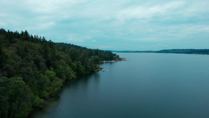 Slow Decend over Lake Washington with a overcast sky during early morning hours Aerial View