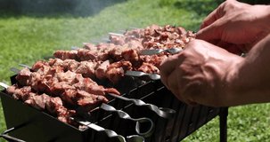 Marinated shashlik cooking on a charcoal grill video slow motion 4k