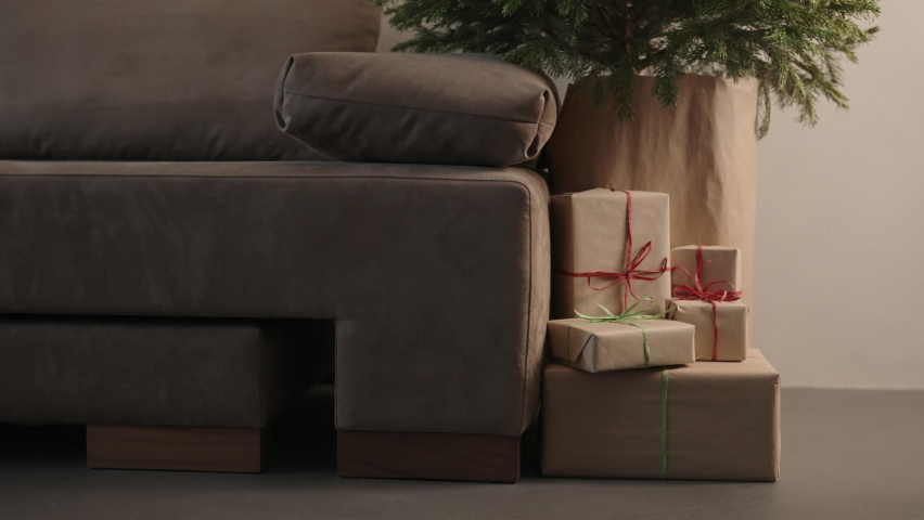 Orbit shot of christmas gifts under spruce indoor with warm light | Shutterstock HD Video #1091771357