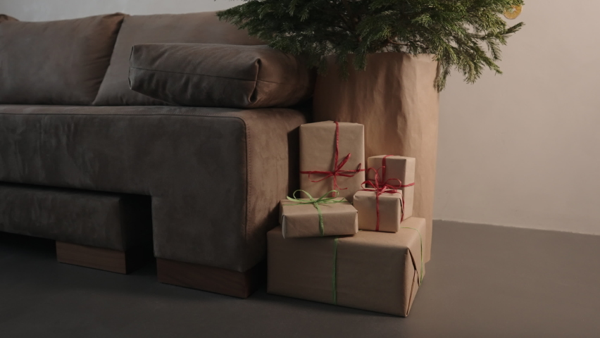 Orbit shot of christmas gifts under spruce indoor with warm light | Shutterstock HD Video #1091771447