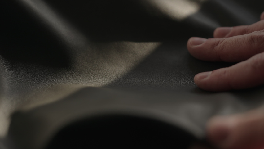 Slow motion man hand touching soft leather with sun shining from a window | Shutterstock HD Video #1091771515