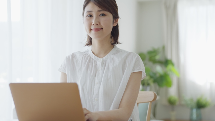Asian woman using a computer Royalty-Free Stock Footage #1091774237