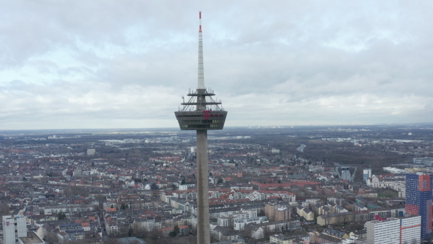 Forwards fly to ring on Colonius telecommunications tower. Former restaurant and lookout platform high above city. Cologne, Germany