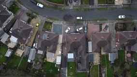 Rising aerial view of a British housing estate in dull weather