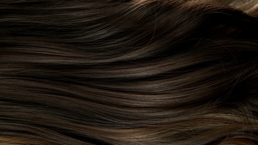 Super slow motion of wavy brown hair in detail. Filmed on high speed cinema camera, 1000 fps.