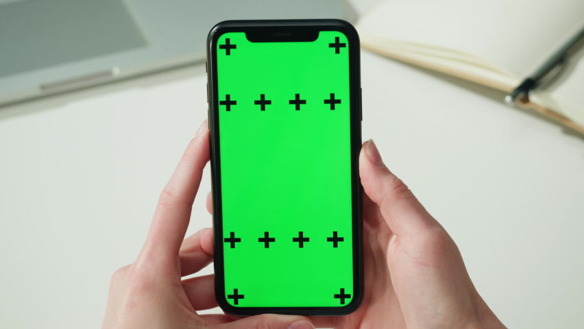 Smartphone with chroma key close-up. Holding mobile phone with green screen. Distance education, e-learning. Doctor workplace, woman nurse working.  | Shutterstock HD Video #1091788369