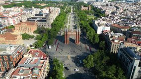 Aerial view of Barcelona Urban Skyline and The Arc de Triomf or Arco de Triunfo in spanish, a triumphal arch in the city of Barcelona. Passeig de Lluís Companys during a sunny day