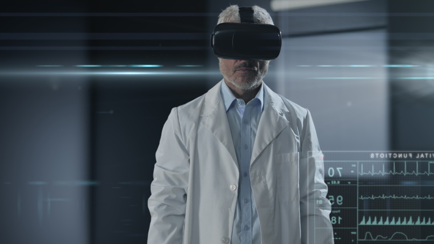 futuristic doctor wearing vr headset using augmented reality graphic interface touchscreen,scientist researcher interacts with artificial intelligence touch screen to study human body Royalty-Free Stock Footage #1091793109