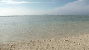OKINAWA, JAPAN : View of clear sea (beach, ocean) in Okinawa island. Sunny summer daytime shot. Clean water, ecology, environment and earth or holiday, vacation and relaxing resort concept video.
