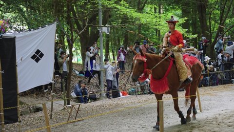 Otsu , Shiga , Japan - 06 13 2022: Samurai Archers Ride Pass Crowd at Yabusame Event at Omi Jingu Shrine 4k