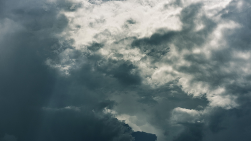 Timelapse of dramatic clouds on dark stormy sky. Heaven background. Epic cloudscape, thunderstorm backdrop. Sinister element Royalty-Free Stock Footage #1091808251