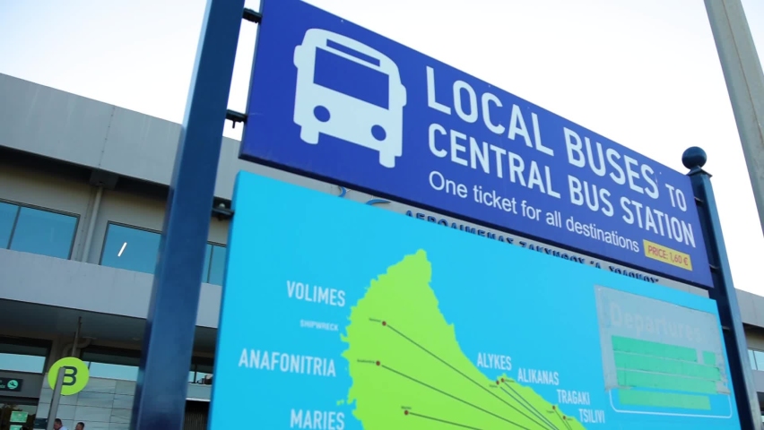 Central bus station sign above city map.
