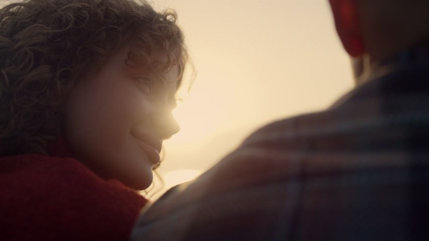Romantic couple spending time together sunset beach. Lovely woman and man looking sunrise. Young hipsters enjoying summer morning. Back view smiling girl putting head on guy shoulder. Love concept