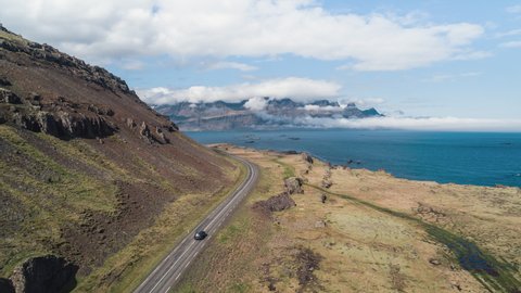 Aerial View Shot of car on the picturesque road, Iceland