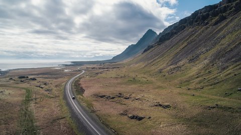 Aerial View Shot of car on the picturesque road, Iceland