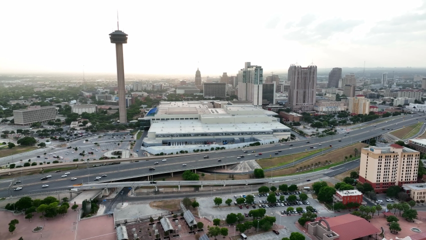 San Antonio skyline at sunset. Tower of the Americas and Convention Center. Aerial by freeway downtown.