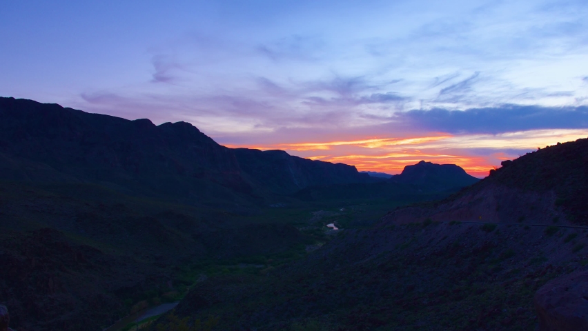 Sunset time-lapse over the Rio Grande River at the US-Mexico Border, near Terlingua, Texas. 4K