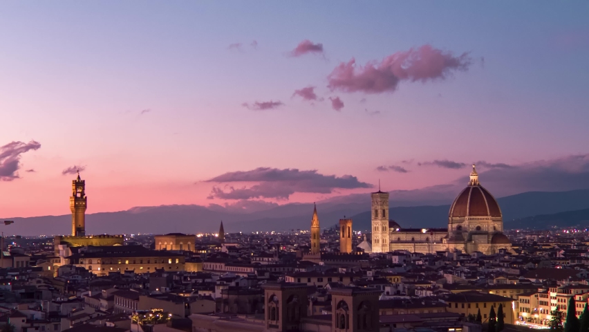 Establishing aerial view of Florence Cathedral, Firenze Cattedrale di Santa Maria del Fiore, Ponte Vecchio and Arno River on a beautiful colourful sunset sky, Tuscany region of Italy Florence Royalty-Free Stock Footage #1091843257