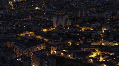 Establishing Aerial View Shot of Marseille Fr, Bouches-du-Rhone, Provence-Alpes-Cote d'Azur, France, city at night evening