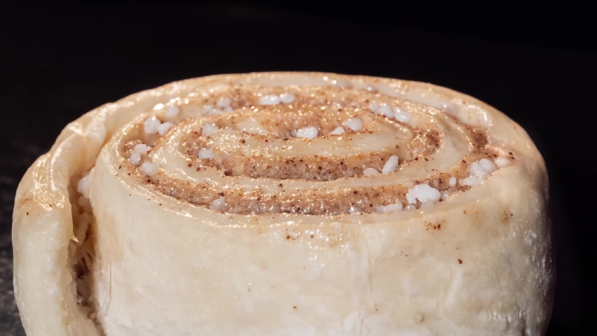 Timelapse - cinnamon bun baking and rising on tray in electric oven at home - zoom in shot, close up view, macro. Swedish cuisine, homemade bakery, food, cooking, pastry and time lapse concept