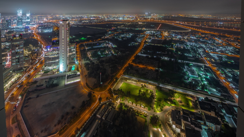 Villas in Zabeel district with skyscrapers on a background aerial panoramic night timelapse in Dubai, UAE. Traffic on streets with illuminated houses and roads | Shutterstock HD Video #1091852491