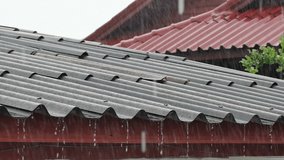In the rainy season, it rains from the roof of a wooden house. Macro Video Slow Motion.