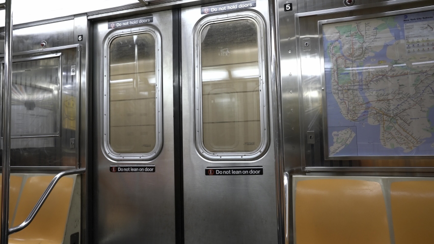 New York City, USA - 27. November 2021: New York Subway map inside Subway car. Public transport in NYC