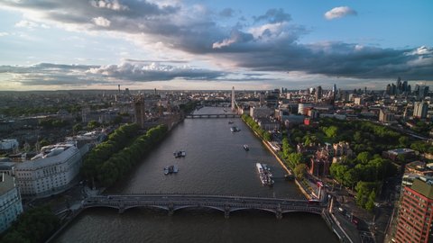 Long Flight over Thames River, Historic Parliament, Big Ben and othe landmarks, Whitehall, Westminster Bridge, Establishing Aerial View Shot of London UK, United Kingdom