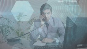 Animation of data processing over caucasian businessman talking on phone. Global business and digital interface concept digitally generated video.