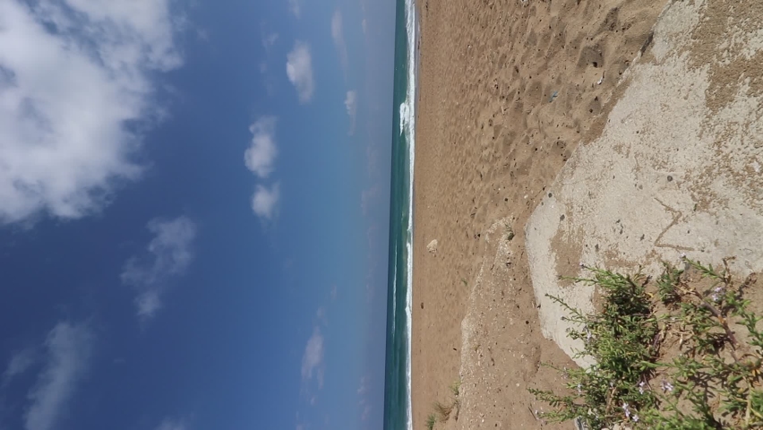 The beach of Atlit - Israel. White sands against the backdrop of a wavy sea