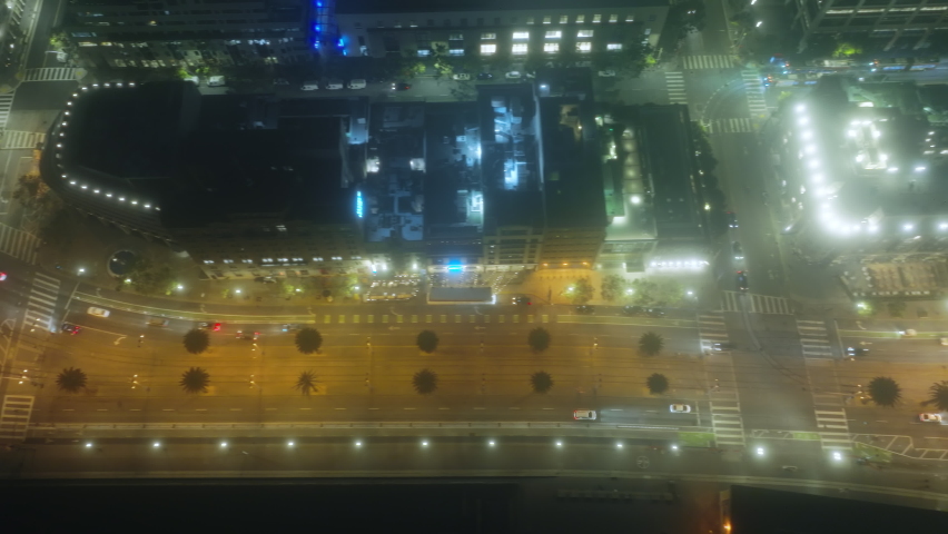 Beautiful aerial top down view of car traffic on city street illuminated at night under fog. 4K drone San Francisco urban cityscape concept of advanced innovation, financial technology, energy power | Shutterstock HD Video #1091881571