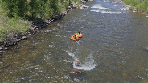 Pagosa Springs , CO , United States - 06 24 2022: People rafting down the San Juan river in Pagosa Springs, CO