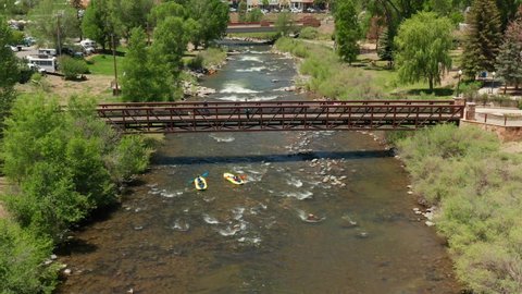 Pagosa Springs , CO , United States - 06 26 2022: People floating down the San Juan River in inflatable rafts, Pagosa Springs, Colorado